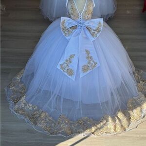 Elegant White and Gold Gown with Bow